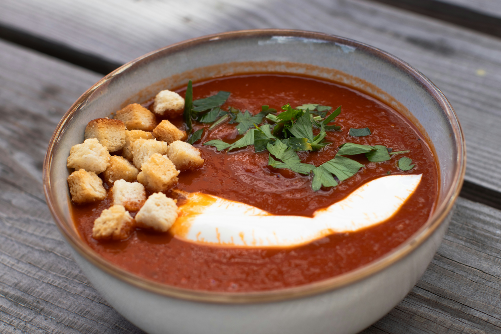 A bowl of spicy red tomato stew, similar to the Nigerian tomato sauce used in Jollof rice